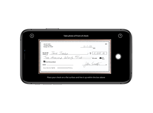 mobile phone displaying a digital image of a written check for mobile deposit