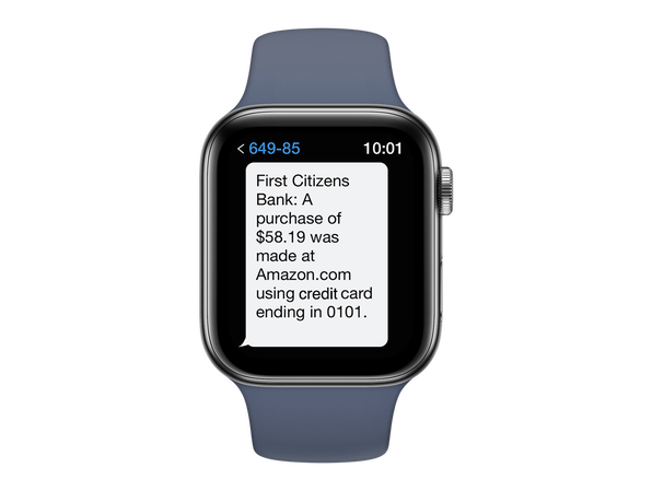 smartwatch displaying alert message that reads First Citizens Bank: A purchase of $58.19 was made at Amazon.com using credit card ending in 0101.