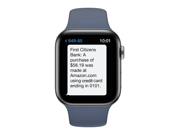 smartwatch displaying alert message that reads First Citizens Bank: A purchase of $58.19 was made at Amazon.com using credit card ending in 0101.
