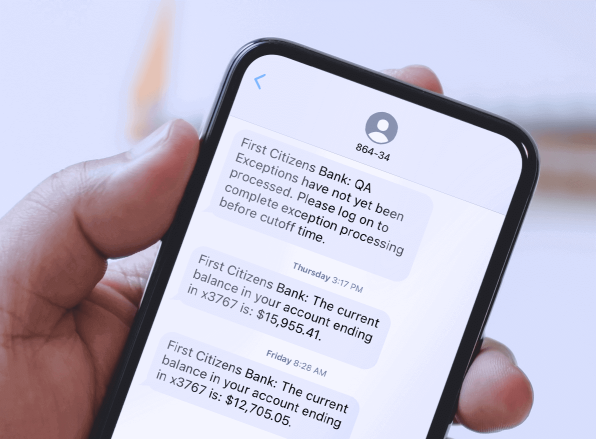 mobile phone screen showing a sample text from First Citizens updating a user on their account balance