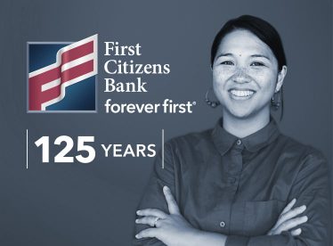Smiling woman celebrates First Citizens Bank foreverfirst 125 years