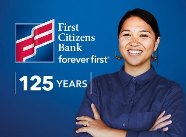 Smiling woman celebrates First Citizens Bank foreverfirst 125 years